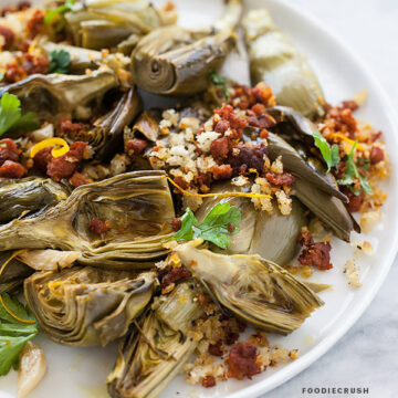 Roasted Artichoke with Chorizo Dressing | FoodieCrush.com