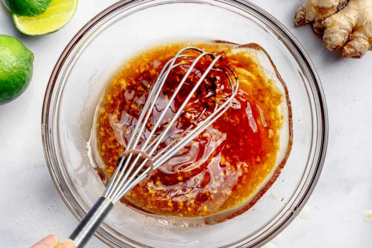 Salad dressing in bowl with whisk foodiecrush.com