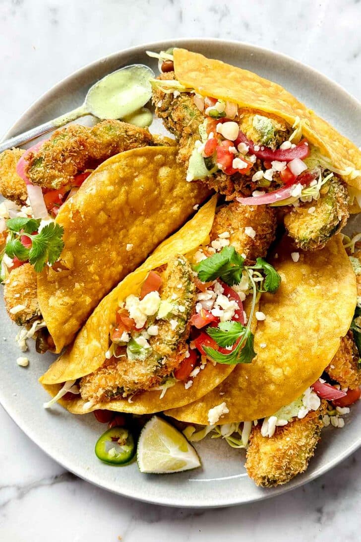 Fried Avocado Tacos on plate foodiecrush.com