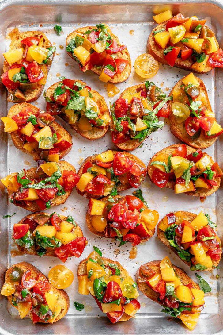 Tomato and Peach Bruschetta on baking sheet foodiecrush.com