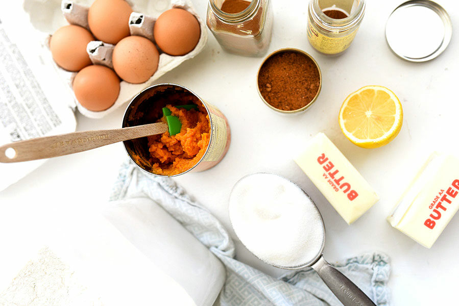 pumpkin roll ingredients on white counter