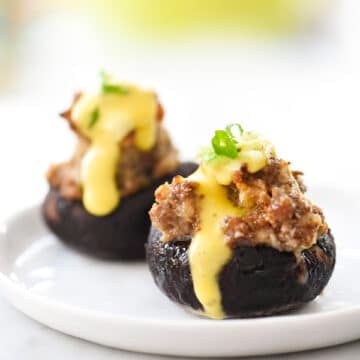 Sausage Stuffed Mushrooms with Hollandaise | foodiecrush.com