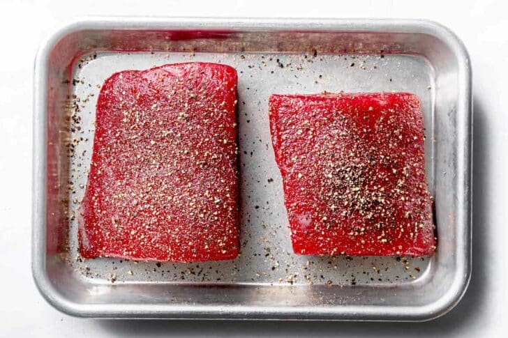 Uncooked Ahi Tuna Steaks on baking sheet foodiecrush.com