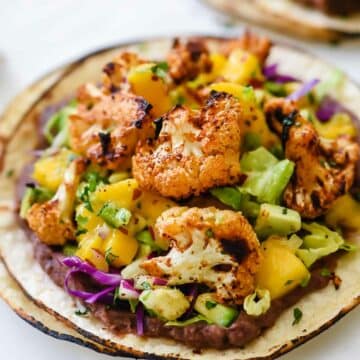 Easy and Healthy Mexican Sriracha Lime Roasted Cauliflower Tostadas recipe foodiecrush.com | easy vegetarian tostadas | black bean tostadas recipe