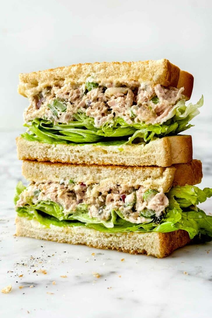 Tuna Salad Sandwich recipe stacked on toasted bread and lettuce foodiecrush.com