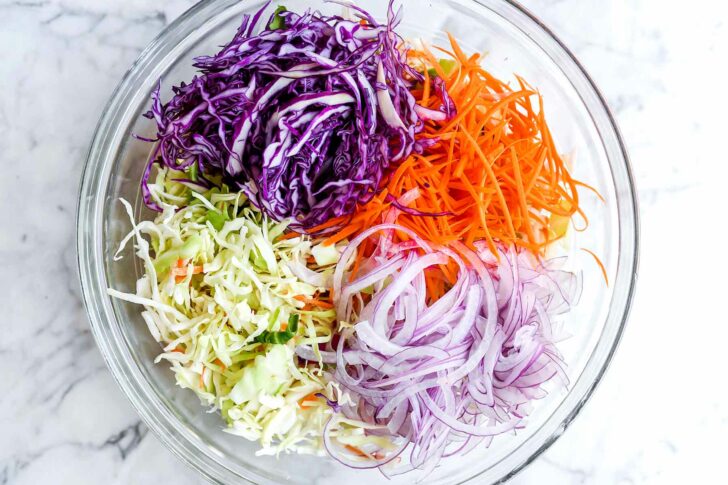 Tangy Vinegar Coleslaw (No Mayo) foodiecrush.com #coleslaw #vinegar #recipes #easy #healthy 